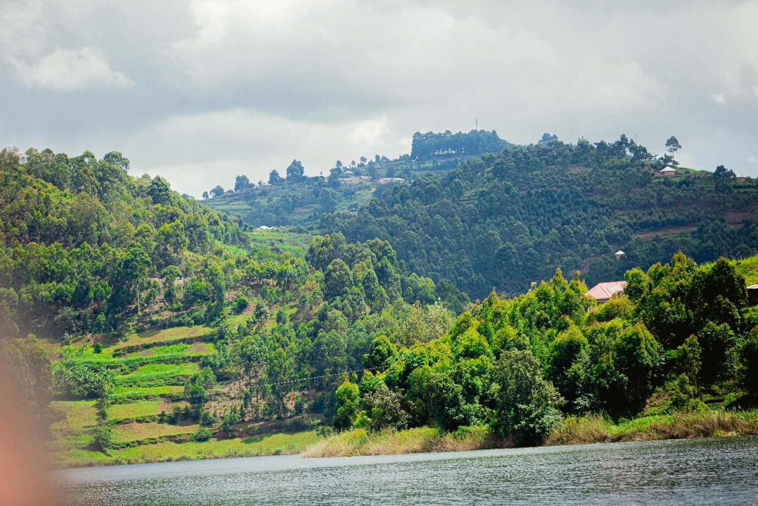 Uganda lake and hillside landscape