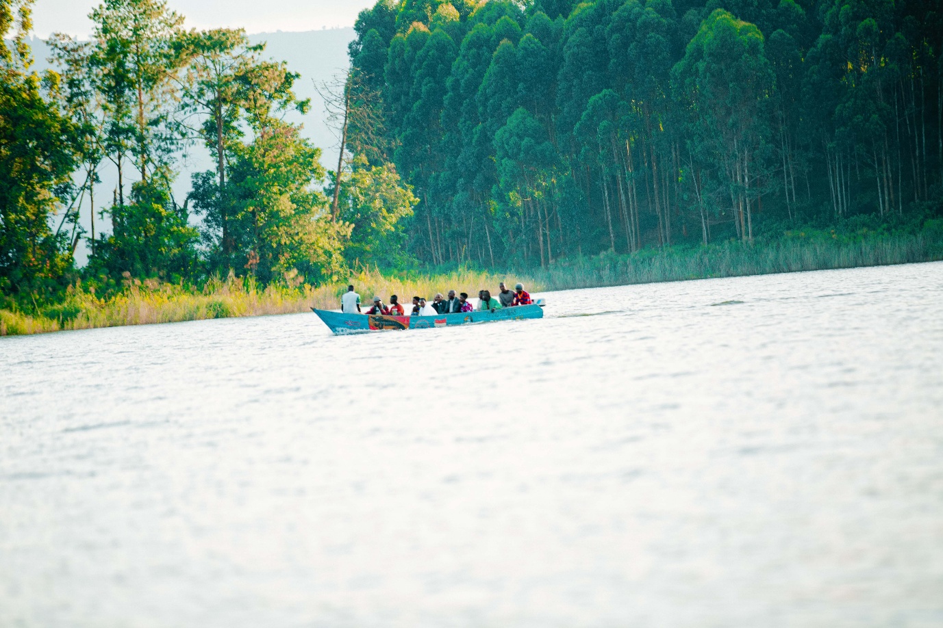 Boat cruise with tourists on Uganda lake